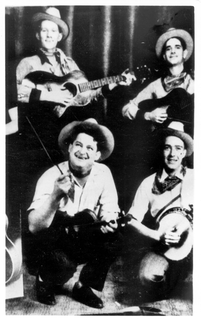 &quot;J.E. Mainer's Mountaineers.&quot;  Photograph, [no date]. Call No. 923, Southern Folklife Collection, Wilson Library, University of North Carolina at Chapel Hill.  Used by permission from the Southern Folklife Collection.  [Top left: Ollie Bunn; Right: Zeke Morris; Bottom left: J.E. Mainer; Botton Right: Wade Mainer.] 